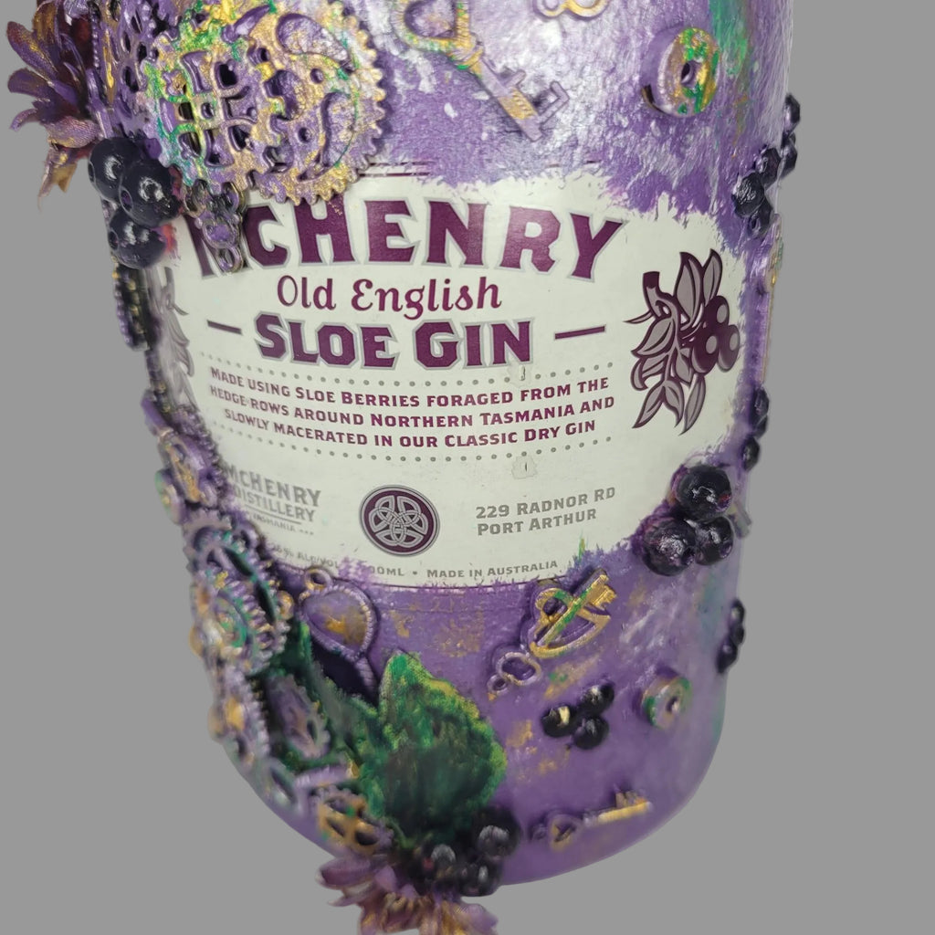 Floral, steampunk inspired abstract repurposed McHenry bottle purple green silver