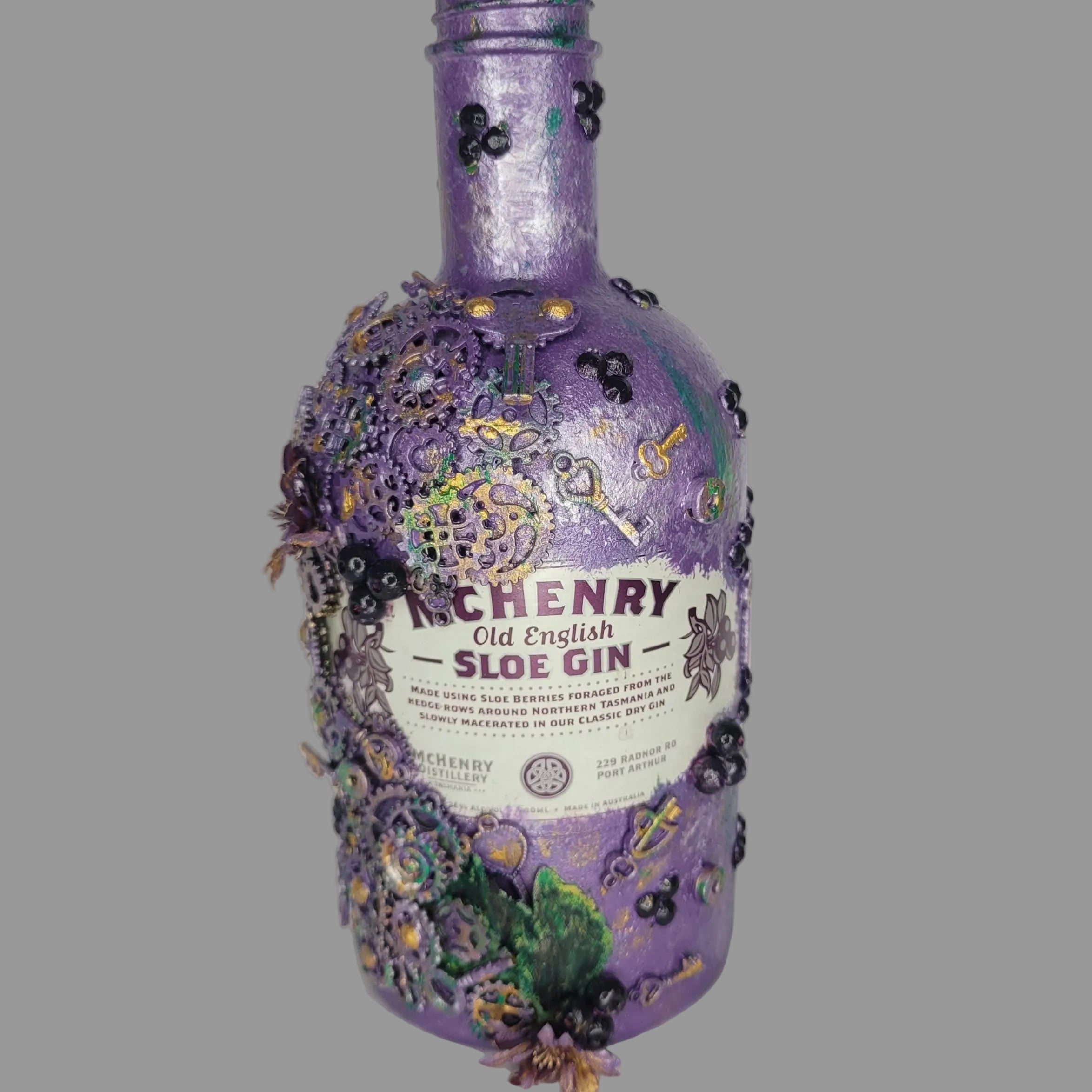 Floral, steampunk inspired abstract repurposed McHenry bottle purple green silver