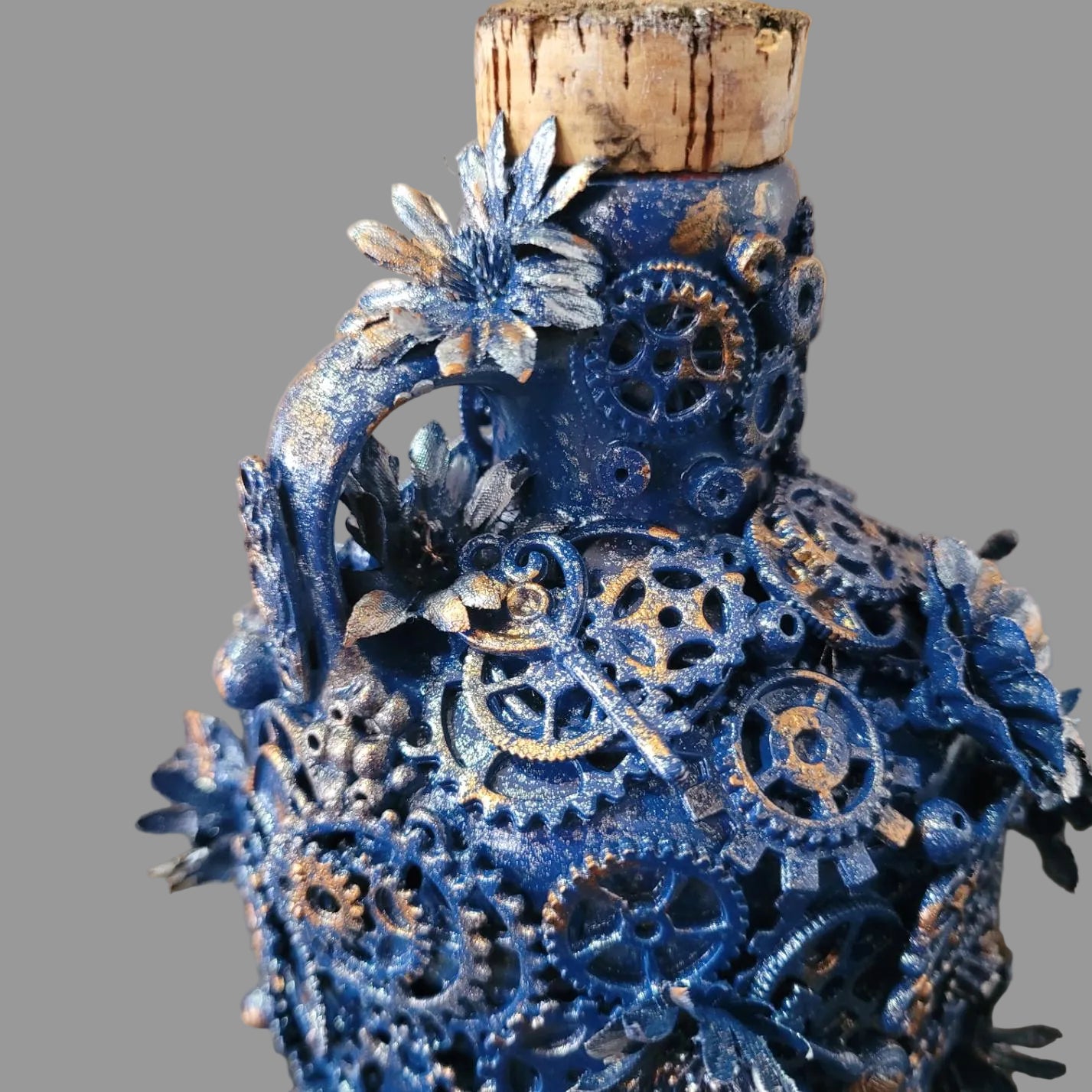 Steampunk and floral inspired upcycled squat ceramic bottle, blue and silver, cork stopper