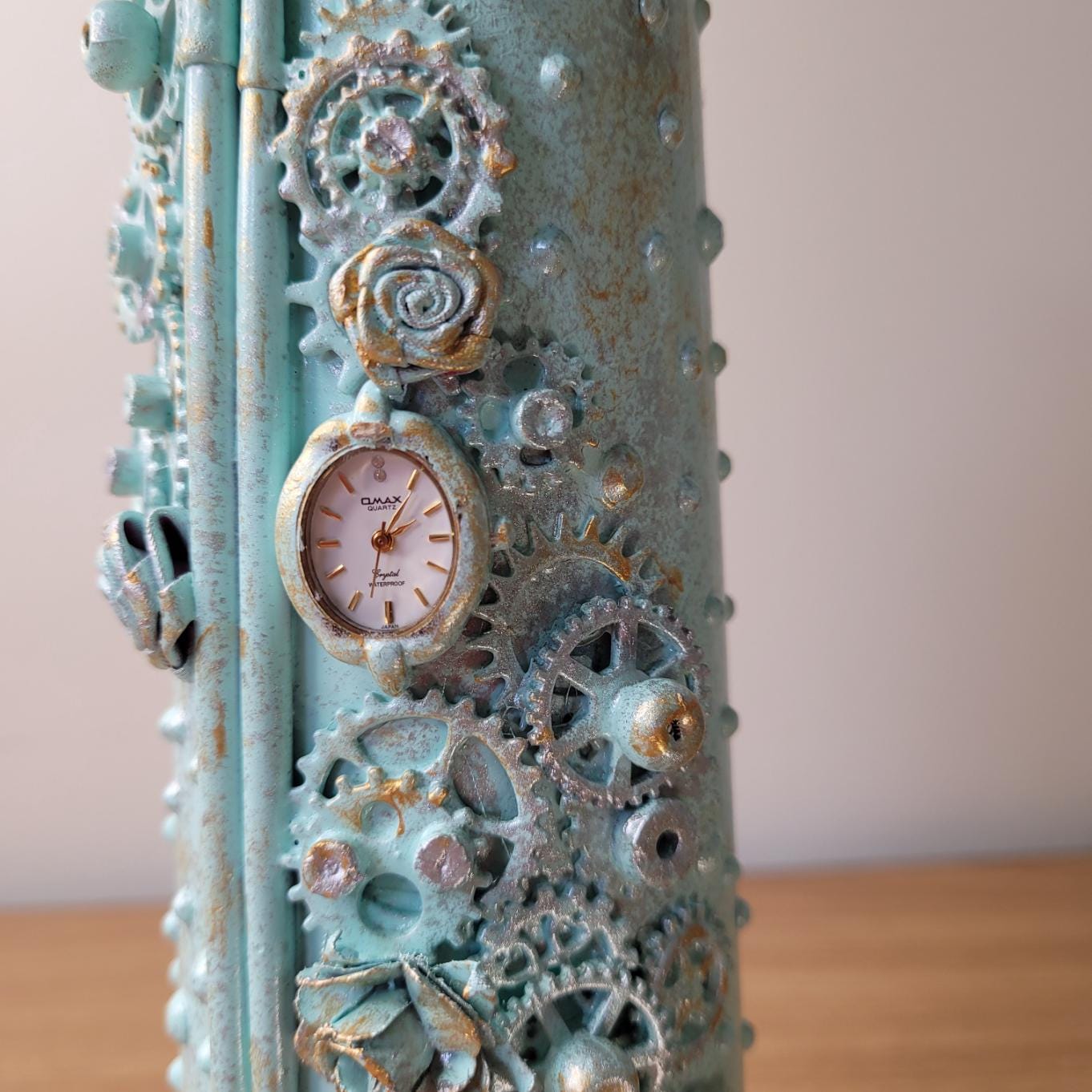 Hand Decorated steampunk bottle, light blue, upcycled watch face
