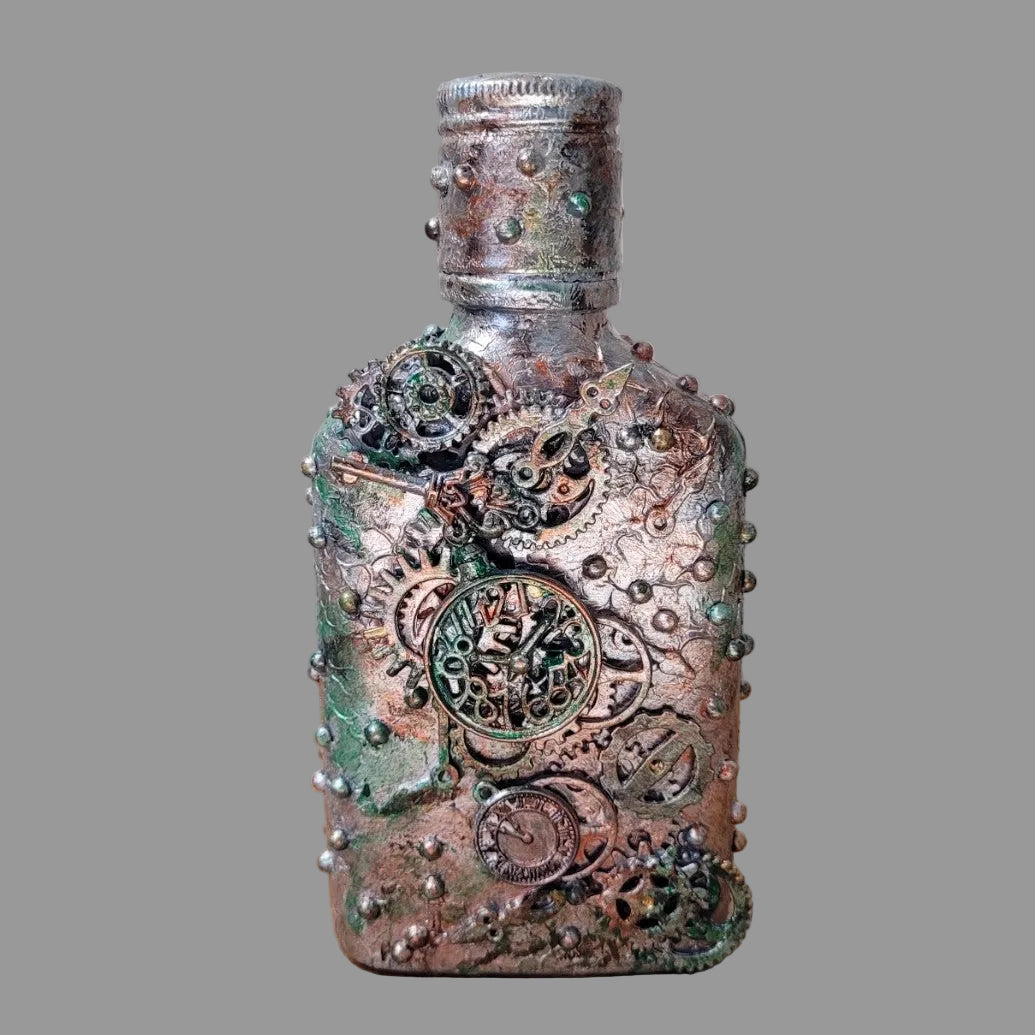 small upcycled bottle hand decorated in steampunk genre