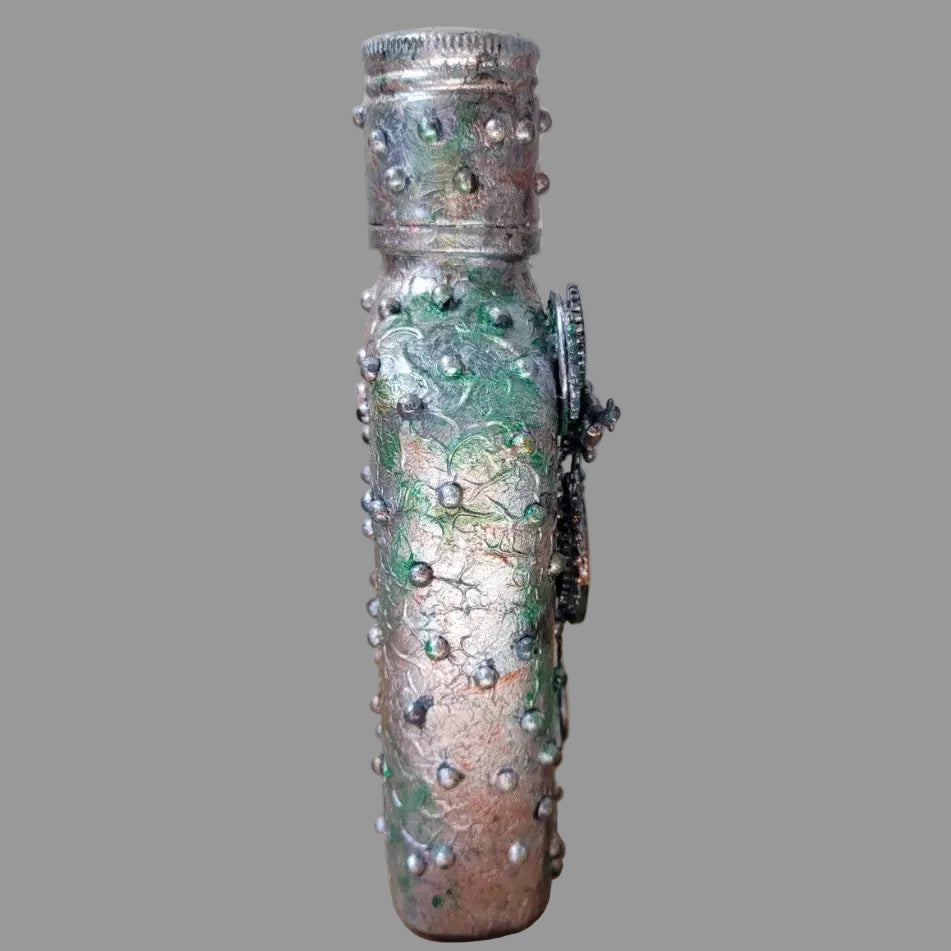 small upcycled bottle hand decorated in steampunk genre