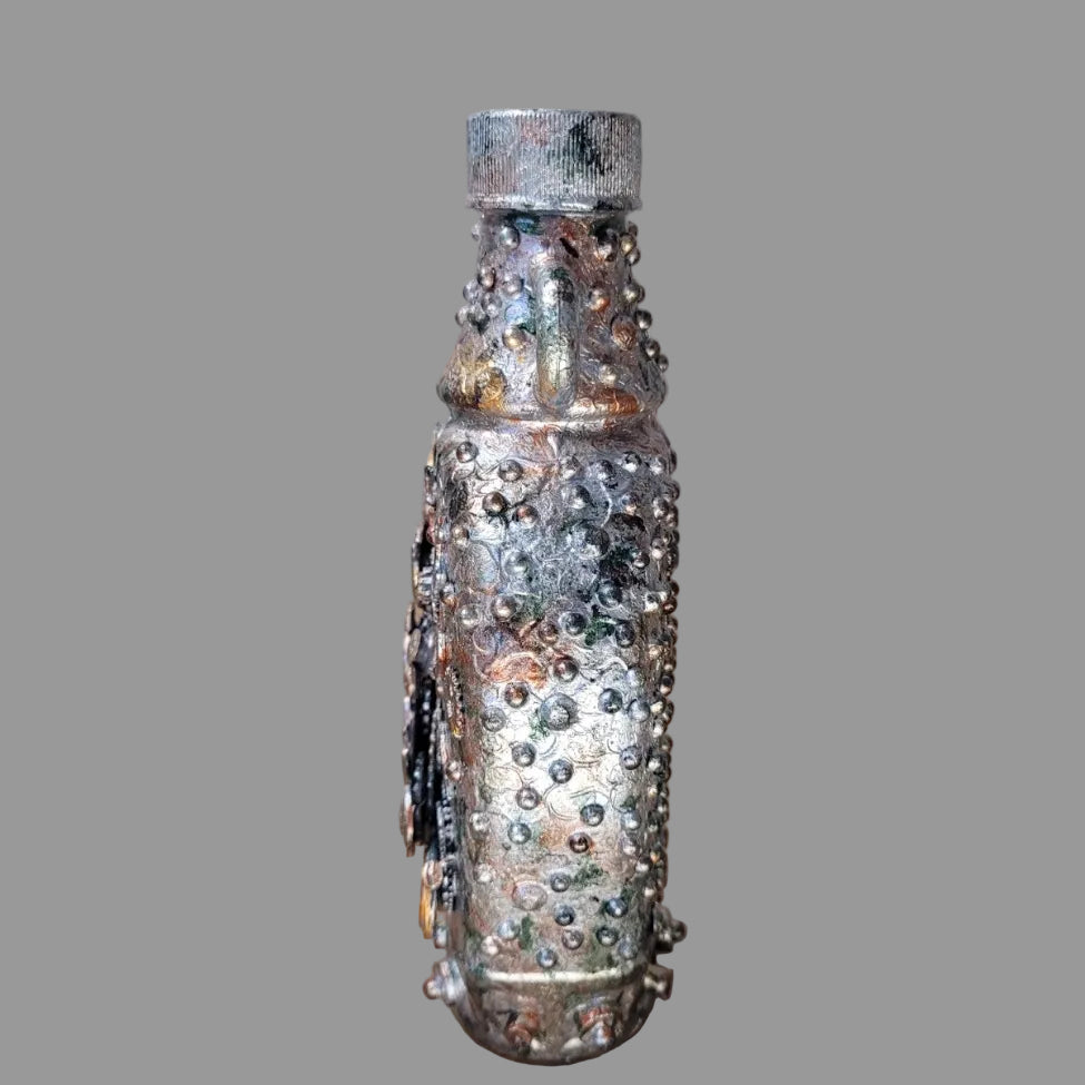 Small upcycled bottle, with handle decorated in steampunk