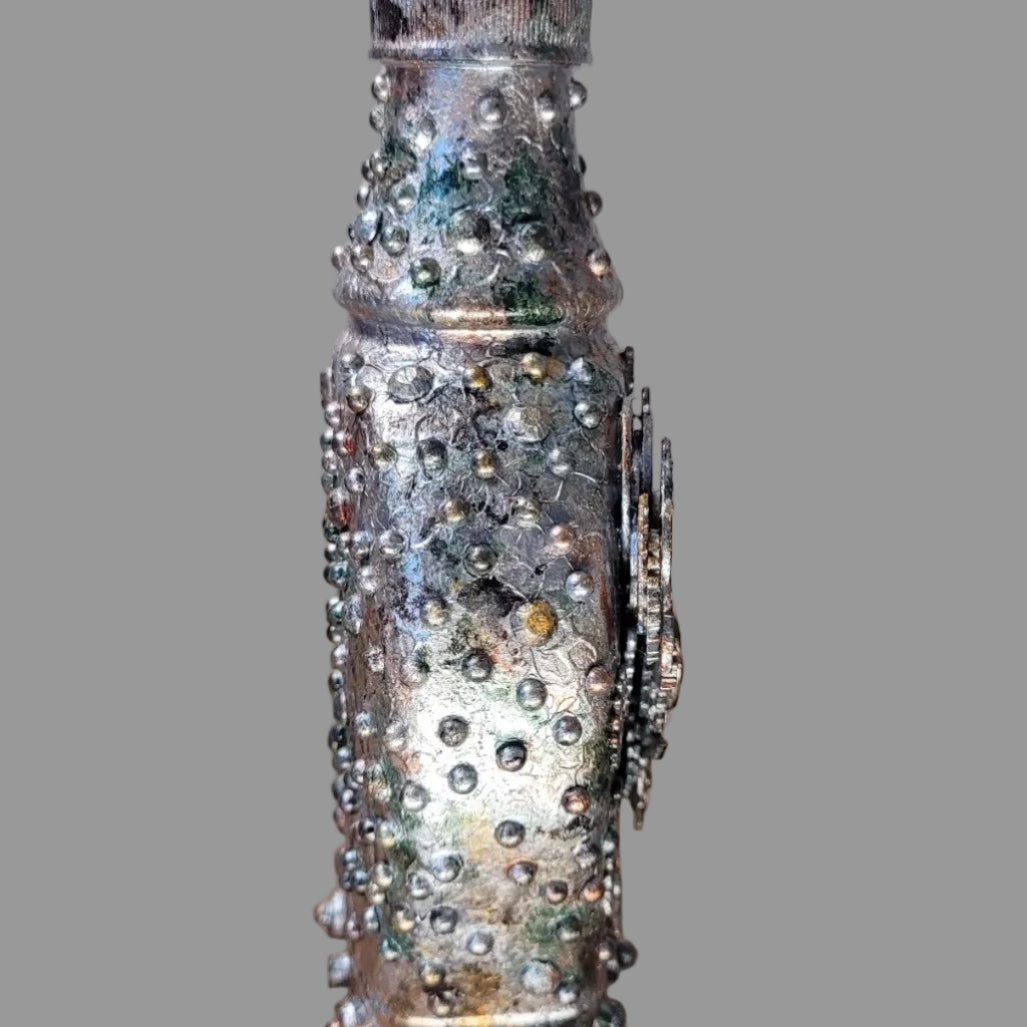 Small upcycled bottle, with handle decorated in steampunk