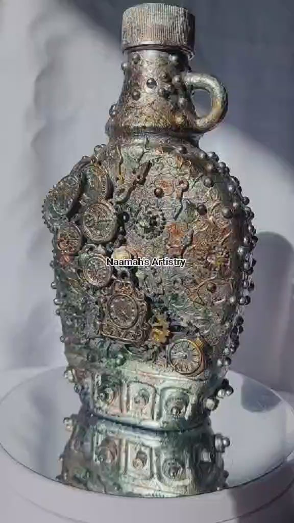 Small upcycled bottle, with handle decorated in steampunk